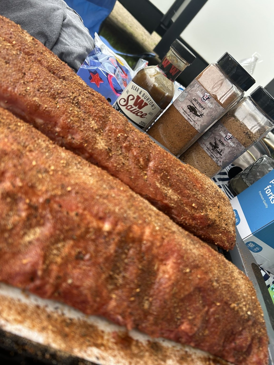 Seasoned ribs ready for the smoker